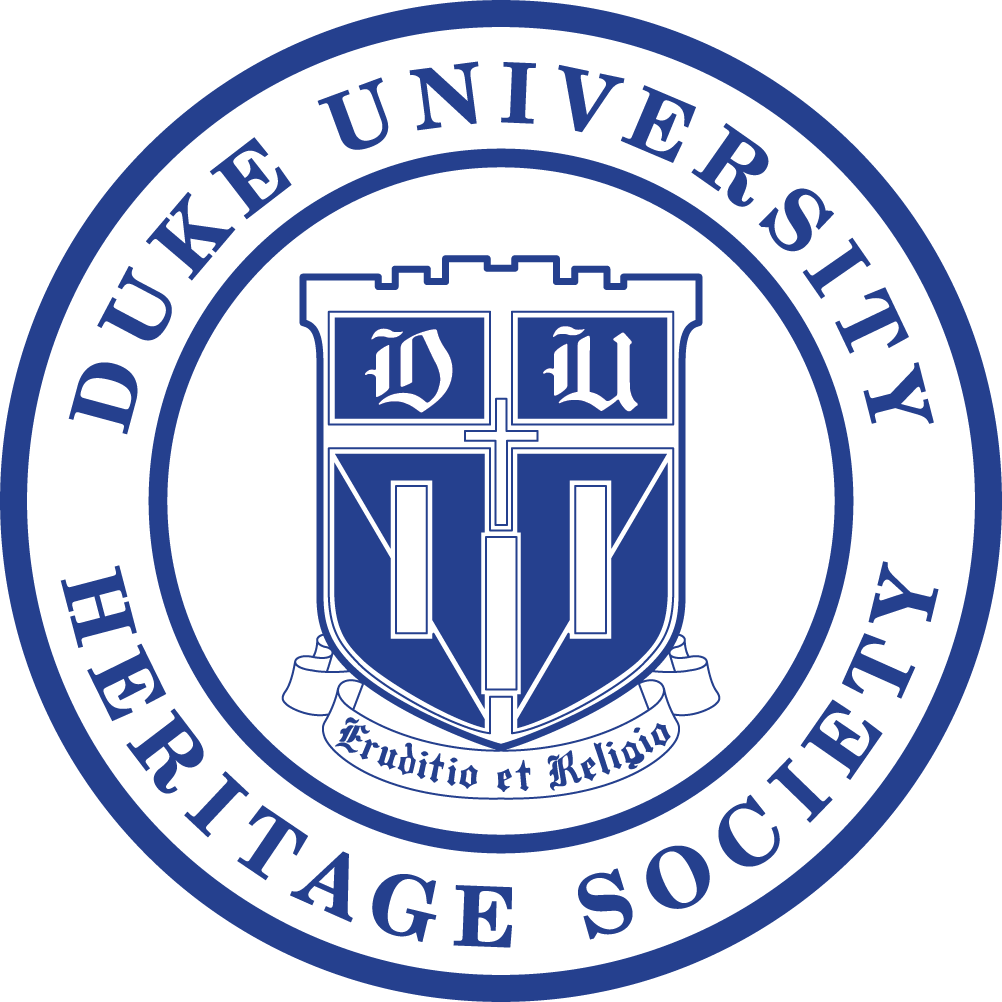 A blue and white logo for the Duke University Heritage Society, picturing a blue Duke Shield in a circle. 