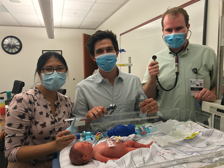 A group of providers in training with simulator baby Paul