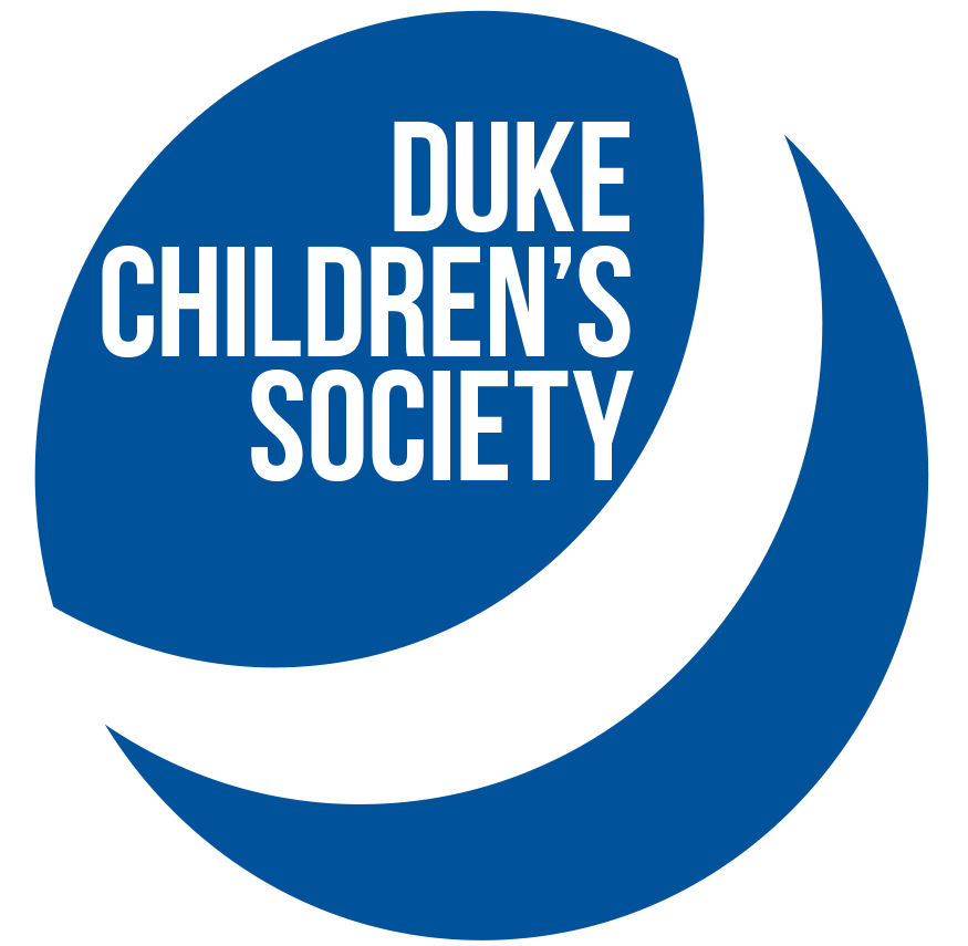 A blue Duke Children's Bouncing Ball with the text "Duke Children's Society" juxtaposed on top of it. 