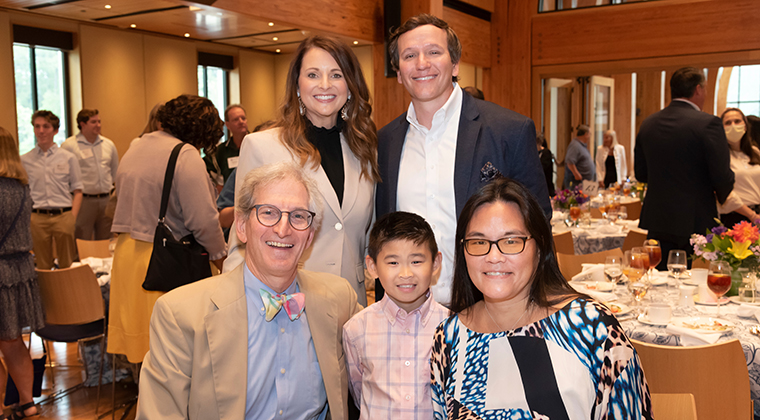 Zach , a Duke Children's patient, sits between two of his doctors: Dr. John Wiener (left) and Dr. Eileen Chambers (right). Zach's parents, James and Julie, stand behind him. 