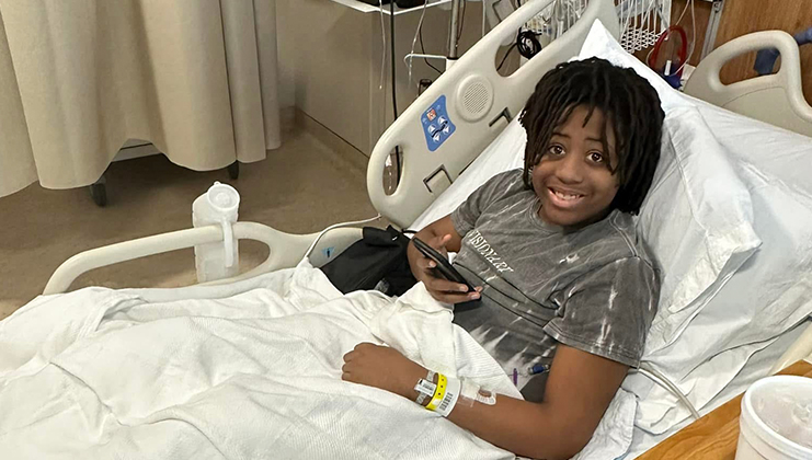 Aaron in Hospital bed receiving sickle cell treatment