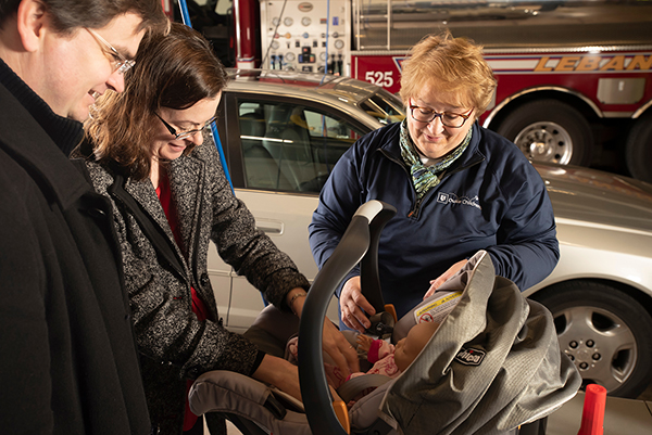 Theresa Cromling's work with Safe Kids includes demonstrating proper car seat installation to families in the Durham Community.