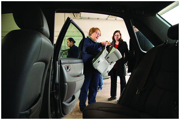 Theresa Cromling checking car seats