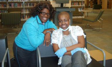 Two women sitting together in a chair
