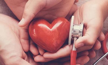 Hands holding a heart