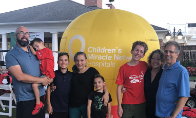 A group of Miracle Families attending the Speedway Golf Tournament pose together