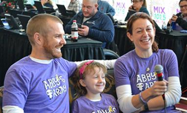 A family sits together during the MIX 101.5 Radiothon for Duke Children's 