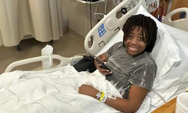 Aaron in Hospital bed receiving sickle cell treatment